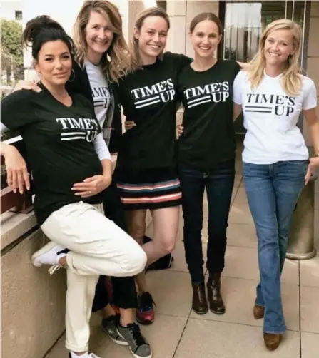  ??  ?? Black and white issue: From left, Hollywood stars Eva Longoria, Laura Dern, Brie Larson, Natalie Portman and Reese Witherspoo­n wearing the Time’s Up T-shirts for a picture they tweeted last night