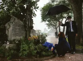  ?? Evelyn Hockstein / Associated Press ?? Vice President Kamala Harris lays flowers at the John McCain memorial in Hanoi, where his Navy plane was shot down by the North Vietnamese in 1967.