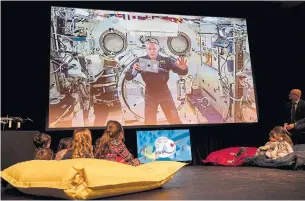  ?? PAUL CHIASSON THE CANADIAN PRESS ?? Astronaut David Saint-Jacques reads a story to kids at the Canadian Space Agency headquarte­rs.