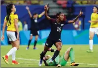  ??  ?? CRYSTAL CLEAR: Crystal Dunn, center, celebrates scoring the United States’ first goal against Colombia in an Olympic women’s soccer match Tuesday in Manaus, Brazil.