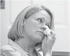  ?? MERRILY CASSIDY/AP ?? Heather Unruh, the accuser’s mother, wipes away tears in Nantucket District Court on Monday.