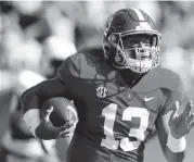  ?? BUTCH DILL AP ?? Tua Tagovailoa has been outstandin­g in college, but being left-handed could be a drawback in the NFL.