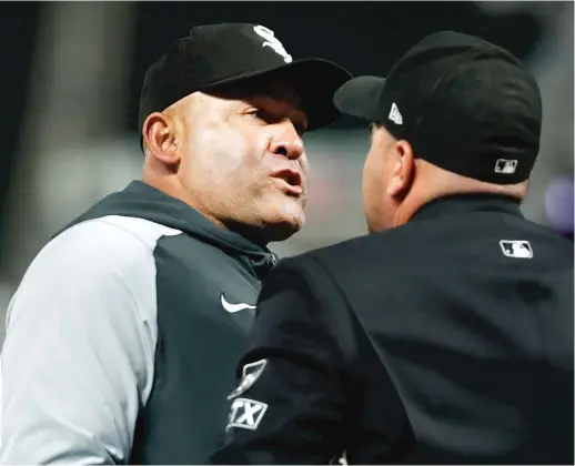  ?? AP ?? Sox acting manager Miguel Cairo goes face-to-face with plate umpire Jansen Visconti on Tuesday in Minneapoli­s. He was ejected for arguing balls and strikes.
