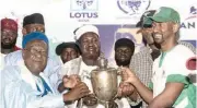  ?? ?? Winners of the Emir of Katsina Cup receive the cup from the Mai Bade of Yobe State, HRH Abubakar Umar Suleiman at the closing ceremony of Kaduna 2023 polo last Sunday