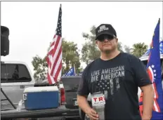  ?? IVP STAFF PHOTOS ?? BOTTOM: Dan Flores, one of the organizers of Saturday’s Trump rally and parade, pauses for a photo before the start of the event.