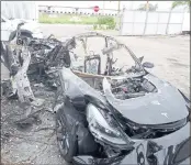  ?? NTSB VIA AP ?? This image provided by the National Transporta­tion Safety Board shows damage to a 2021 Tesla Model 3 Long Range Dual Motor electric car following a crash in September.
