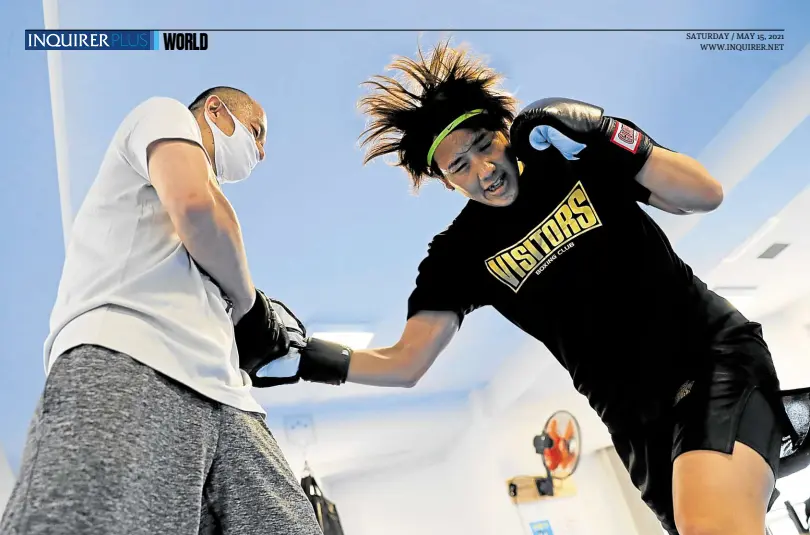  ?? —PHOTOS BY REUTERS ?? ALL FOR NOTHING? Arisa Tsubata (right), 27, a nurse and a boxer, has trained around her work shifts for over a year in the hope of making it to the Tokyo Games this summer. That dream was shattered earlier this year after the Internatio­nal Olympic Committee decided to cancel the boxing qualifiers due to take place in June.