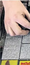  ??  ?? RIGHT A worker adjusts letters on a plaque. BELOW People work in the printing company’s workshop.