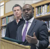  ?? RICH PEDRONCELL­I — THE ASSOCIATED PRESS ?? State Superinten­dent of Public Instructio­n Tony Thurmond, shown in 2019, answers a reporter’s question during a visit with California Gov. Gavin Newsom, background, to Blue Oak Elementary School, in Cameron Park, California.