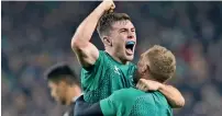  ?? AFP ?? Ireland’s Luke McGrath (left) celebrates their 16-9 win over world champions All Blacks. —