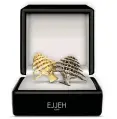  ??  ?? CEDAR PIN
by Ejjeh 1926 in collaborat­ion with Vishnu Concept
Available in gold and silver, wear your very own Lebanese cedar pin with pride.
90,000 LBP ejjeh.com