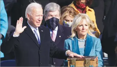  ?? Getty Images/tns ?? Joe is sworn in as U.S. President during his inaugurati­on on the West Front of the U.S. Capitol on Wednesday Washington, DC.