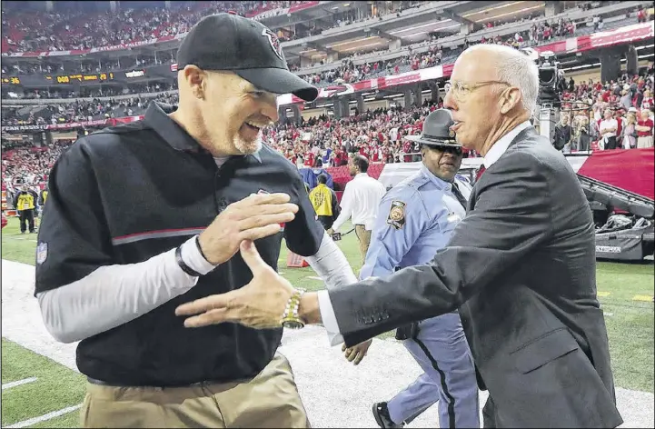  ?? CURTIS COMPTON / CCOMPTON@AJC.COM ?? Falcons coach Dan Quinn and Falcons president Rich McKay celebrate their team’s 36-20 victory over the Seattle Seahawks during an NFC divisional playoff game. The Falcons move on to the NFC Championsh­ip game for the fourth time in franchise history.