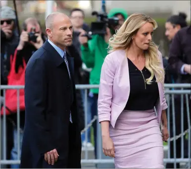  ?? SETH WENIG
THE ASSOCIATED PRESS ?? Stormy Daniels, right, and her attorney Michael Avenatti turn from the microphone­s after speaking as they leave federal court in New
York, in this file photo. California lawyer Avenatti wants leniency at sentencing for defrauding former client Daniels of hundreds of thousands of dollars, his lawyers say, citing a letter in which he told Daniels: “I am truly sorry.” The emailed letter, dated May 13, was included in a submission his lawyers made late Thursday in Manhattan federal court in advance of a June 2 sentencing.