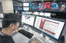  ?? Yonhap ?? AT THE KOREA INTERNET and Security Agency in Seoul, a worker on Monday monitors the spread of the ransomware cyberattac­k known as WannaCry.