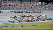  ?? AP-Butch Dill, File ?? In this 2019 file photo, Ryan Blaney (12) leads a pack of cars through the tri-oval at Talladega Superspeed­way in Talladega, Ala. NASCAR is permitting up to 5,000 fans and, officials hope, zero Confederat­e flags to attend the NASCAR Cup series race Sunday along with 44 motor homes.