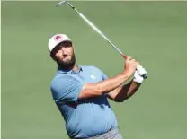  ?? (AFP) ?? Jon Rahm of Spain plays a shot during a practice round prior to the 2024 Masters Tournament at Augusta National Golf Club in Augusta, Georgia, yesterday.