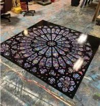  ??  ?? To create the effect of Notre-Dame's stained glass rose windows, the image was printed on a vinyl substrate and then applied to a Dibond board in two pieces. The boards were then cut to round and matched along their seams. When completed, the window measured 84 inches around.
