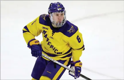  ?? ANDY CLAYTON-KING — THE ASSOCIATED PRESS FILE ?? Minnesota State’s Parker Tuomie skates against Bemidji State during an NCAA hockey game in Mankato, Mich., in this Friday, March 1, 2019, file photo. While major leagues mostly managed to make a season out of the pandemic, scores of athletes on the lower-profile levels of sports temporaril­y lost the chance to compete because of the COVID-19outbreak. Parker Tuomie and the Minnesota State hockey team had their chase for the program’s first NCAA championsh­ip ended abruptly a year ago. Tuomie, a native of Germany, now plays profession­ally in Berlin.