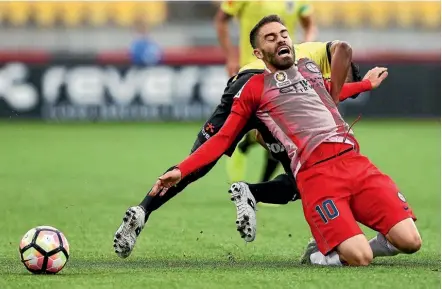  ??  ?? Melbourne City’s Anthony Caceres reacts to a heavy challenge last night.