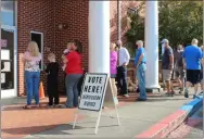 ?? File ?? In this file photo, a line stretched out of the Gordon County Board of Elections Office on Oct. 12, the first day of early voting for the 2020 presidenti­al election. Early voting in the Jan. 5 runoff elections begins on Monday, Dec. 14.