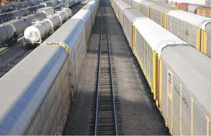  ?? MARIO TAMA/GETTY IMAGES ?? Freight rail cars in a rail yard last Tuesday in Wilmington, California.