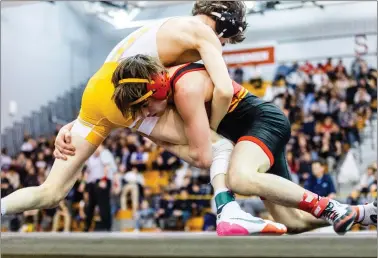 ?? NATE HECKENBERG­ER - FOR MEDIANEWS GROUP ?? Haverford High’s Cole McFarland, right, gets in on a shot during a 4-3loss to Central Bucks West’s Chris Dennis in the 114-pound final Saturday at the regionals.