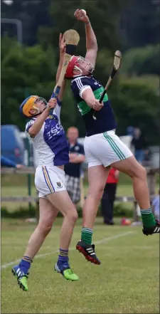  ??  ?? Sean O’Callaghan of St Patrick’s and Padraig Doyle of Bray Emmets battle for the ball.