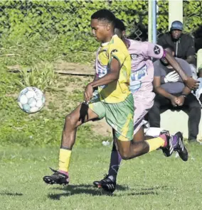  ?? Reid) (Photo: Paul ?? Green Pond High’s Garth-dave Bromwell (left) tries to get away from Irwin High’s Ranaldo Blackwood in their St James FA Sandals Resorts Internatio­nal Under-17 semi-finals played at Wespow Park last month. Irwin won the game 2-1 and will play in Sunday’s final against Athletes In Action.