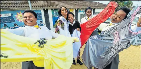  ?? Picture: EUGENE COETZEE ?? OVER THE MOON: Walmer High School pupils welcoming their donated matric dance dresses are, from left, Nombuso Qolana, 18, Mrs Africa World Noni Mbete, 27, Sisize Maranjana, 18, Anathi Sintwa, 17, and Vuyelwa Breakfast, 18