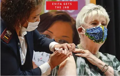  ?? ARMAND HOUGH African News Agency( ANA) ?? TANNIE Evita Bezuidenho­ut (performer Pieter-Dirk Uys) receives her Covid-19 vaccinatio­n from Sister Hazel Andrew at the Wesbank Community Hall in Malmesbury yesterday.