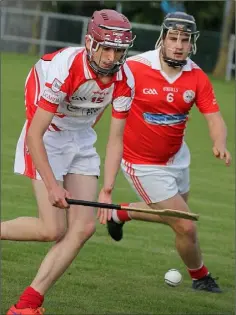  ??  ?? Stephen Warren of Ferns St. Aidan’s is watched closely by Monageer-Boolavogue defender Robert Donnelly.