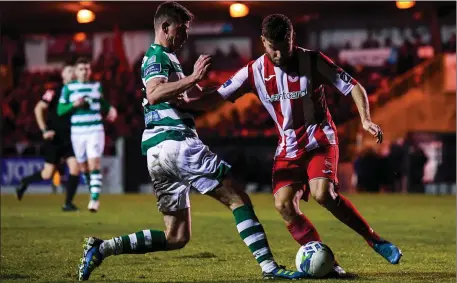  ??  ?? Ronan Finn of Shamrock Rovers tries to dispossess Alex Cooper.
Pic: Stephen McCarthy/Sportsfile