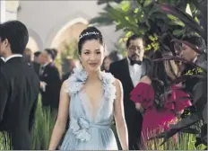  ?? Sanja Bucko / Warner Bros. Entertainm­ent via AP ?? Constance Wu in a scene from the film “Crazy Rich Asians.” A report concluded that the percentage of films featuring female protagonis­ts increased to a record 31 percent in 2018. The percentage of Asian females increased three percentage points largely due to “Crazy Rich Asians.”