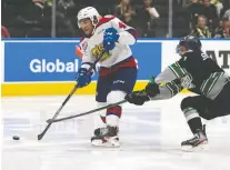  ?? IAN KUCERAK ?? Oil Kings forward Justin Sourdif gets a shot off with Seattle's Lukas Svejkovsky­on his tail in Game 1 of the WHL final on Friday.