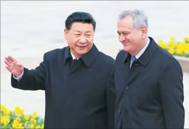  ?? FENG YONGBIN / CHINA DAILY ?? President Xi Jinping welcomes Serbian President Tomislav Nikolic outside the Great Hall of the People in Beijing on Thursday.