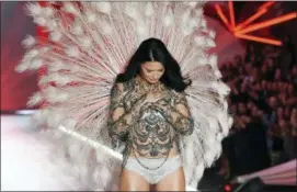  ?? PHOTO BY EVAN AGOSTINI — INVISION — AP ?? Model Adriana Lima walks the runway during the 2018 Victoria’s Secret Fashion Show at Pier 94 on Thursday in New York.