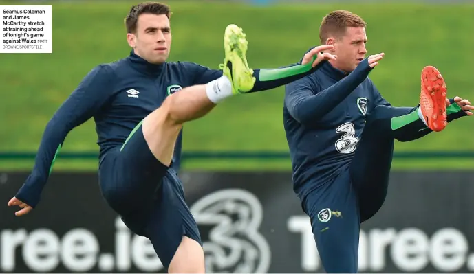  ?? MATT BROWNE/SPORTSFILE ?? Seamus Coleman and James McCarthy stretch at training ahead of tonight’s game against Wales