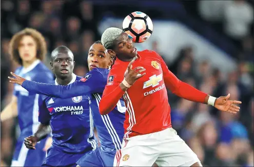  ?? FRANK AUGSTEIN / AP ?? Manchester United’s Paul Pogba controls the ball in front of Chelsea’s Willian during their English FA Cup quarterfin­al match at Stamford Bridge in London on Monday. Chelsea won 1-0 and will face Tottenham in the semifinal.