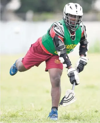  ?? PHOTO BY RICARDO MAKYN ?? Rameish Jones of Wolmer’s Boys School goes through his paces during a lacrosse training session at Emmett Park on Friday.