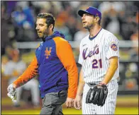  ?? Frank Franklin II The Associated Press ?? Mets pitcher Max Scherzer heads toward the dugout with trainer Joseph Golia during the sixth inning of New York’s 11-4 victory over the Cardinals on Wednesday at Citi Field.