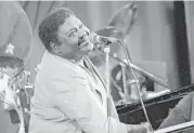  ?? Patrick Kovar / AFP / Getty Images ?? Fats Domino said he was “lucky enough to write songs that carry a good beat and tell a real story that people could feel was their story, too.”