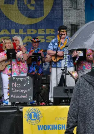  ?? ?? A spot of rain didn’t deter visitors to Wokingham Lions’ May Fayre