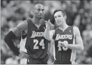  ?? NATHAN DENETTE/ THE CANADIAN PRESS ?? Los Angeles Lakers guards Kobe Bryant and Steve Nash talk during a timeout in Toronto on Sunday.