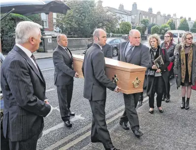  ?? PHOTO: COLIN KEEGAN ?? Prodigy: Ulick’s remains are carried into church as his niece, Mary Buckley, and great nieces Jenni and Laura Kilgallon look on.