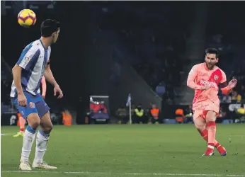  ?? Reuters ?? Lionel Messi scores the fourth goal for Barcelona against Espanyol. It was his second of the match. Both goals came from free-kicks, making it nine direct shots in 2018 for the Argentine