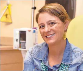  ?? Timothy D. Easley/AP ?? Lara MacGregor, a participan­t in a new crowdsourc­ing project for metastatic breast cancer research, poses for a photo as she undergoes treatment at the Norton Cancer Center in Louisville, Ky., on Wednesday, Sept. 21, 2016. In just the first year, more than 2,600 affected patients have enrolled in the project, submitting samples and medical records by mail. "I hope that real data about real people is going lead to better treatment options," she says. "My life depends on it."