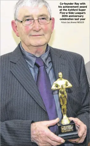  ?? Picture: Gary Browne FM2552311 ?? Co-founder Ray with his achievemen­t award at the Ashford Super Five-a-Side League’s
30th anniversar­y celebratio­n last year