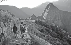  ?? Chris Riemenschn­eider/Minneapoli­s Star Tribune/TNS ?? ■ Visitors approach Machu Picchu from the Sun Gate off the Inca Trail.