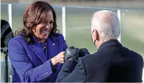  ?? REUTERS ?? In touch: Vice-president Kamala Harris celebrates, fist bumping with Mr Biden